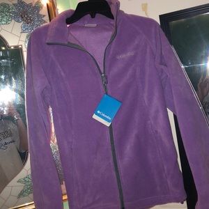 A woman’s purple columbia jacket